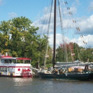 a boat is docked next to a body of water